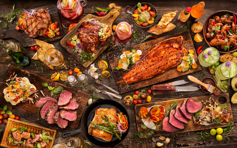 A table set with a vast selection of meats and fish as good sources of creatine